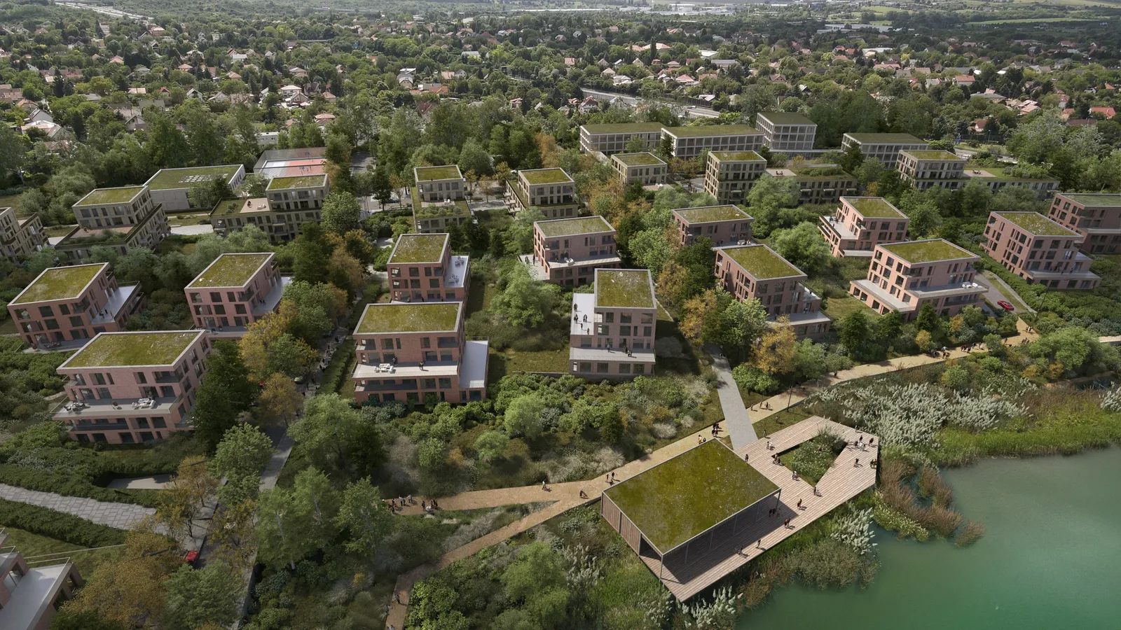 Légi látványterv a lakóparkról: extenzív zöldtetős épületek és a tó fölé nyúló, zöldtetős közösségi stég-pavilon