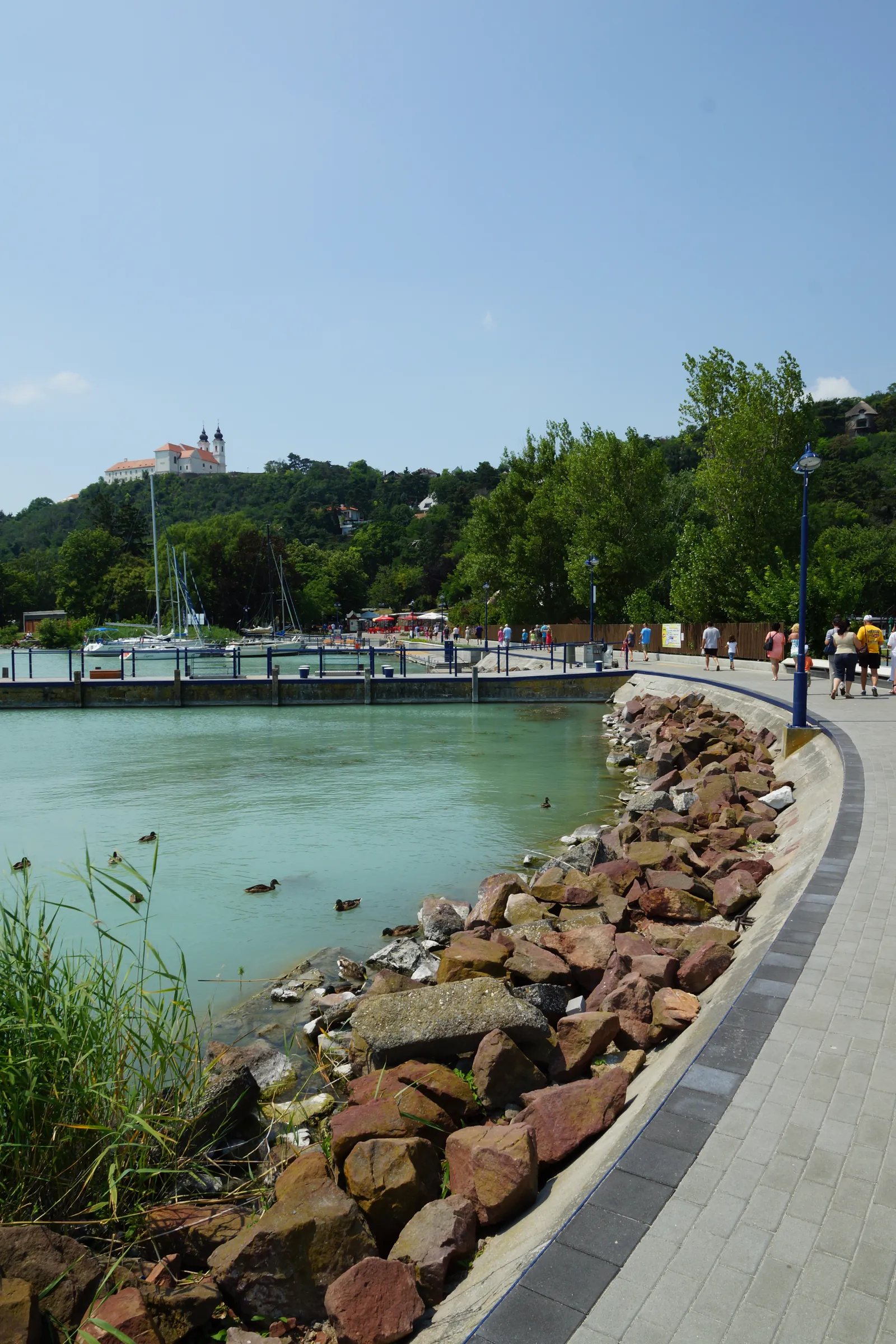 View of the harbour bay with the renovated rip-rap shoreline, the Tihany Abbey and the marina in the background